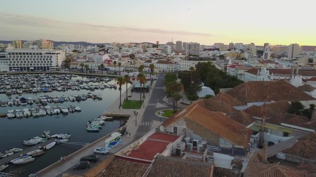 Aerial view of old town, modern architecture, marina and nature, Faro, Portugal