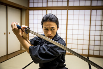 Samurai training in a traditional dojo, in Tokyo