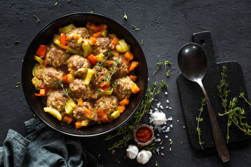 Meatballs in sauce with vegetables, top view