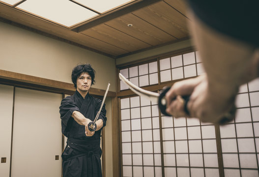 Samurai training in a traditional dojo, in Tokyo