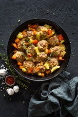 Meatballs in sauce with vegetables, top view
