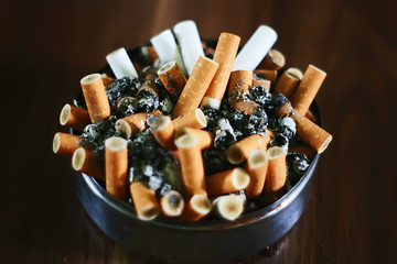 ashtray  full of cigarette butt
