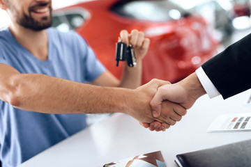 Fototapeta premium Two men shake hands, making a deal.