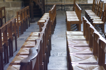 Wooden chairs inside a old church