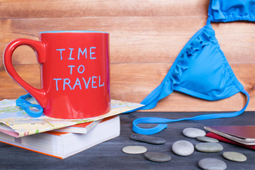 Travel concept, traveler`s accessories on the wooden background.