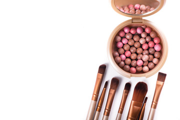 Powder balls and cosmetic brush isolated