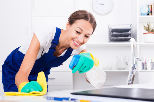 woman cleaning in company office