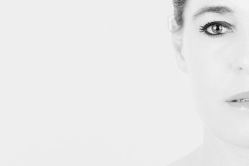 Naklejka premium High key portrait of a woman with only half of her face