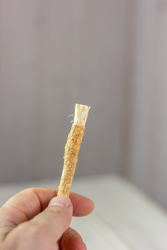 Miswak or siwak - arabian toothbrush for tooth cleaning on white.