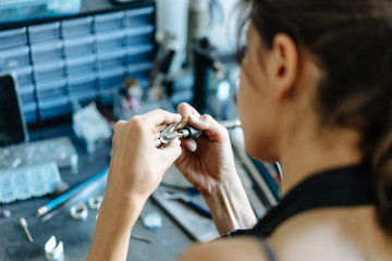 The girl is engaged in jewelry business