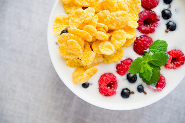 tasty breakfast with cereals and yoghurt raspberry