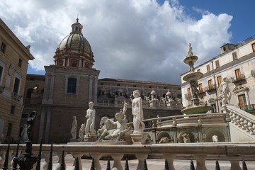Catholic cathedral square with fountain in Sicily, Italy