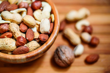 Assorted nuts in wooden bowl