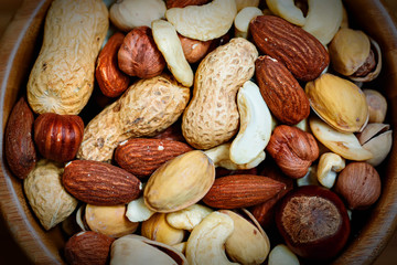 Assorted nuts in wooden bowl
