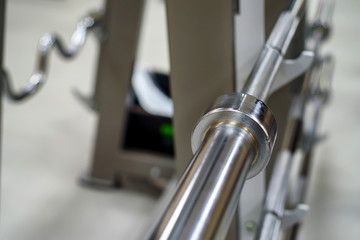 Barbell holder on a blurred gym background