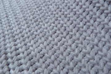 knitted scarf of woolen threads close-up knitted cloth clothing design textiles natural materials close-up wallpaper background texture