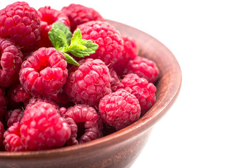 ripe raspberry on bowl isolated