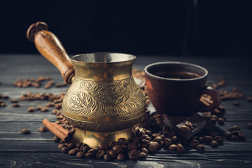 Old coffee cup and turk with roasted beans - 183377559