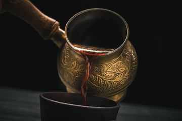 Pouring turkish coffee - obrazy, fototapety, plakaty