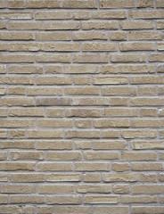 Obraz premium vertical part of yellow creme brick wall with cement joints