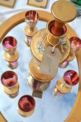set of decorated bottle with glasses and tray