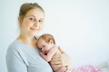 Fototapeta na wymiar Mother with her baby