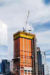 Fototapeta na wymiar Building with Cranes