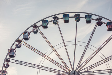 Ferris wheel in amusement park against sky