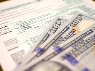 Tax form 1040 and dollars