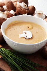 Mushroom cream soup with herbs and champignons