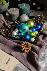 Christmas decorations, balls, candles. Blue, white and gray.