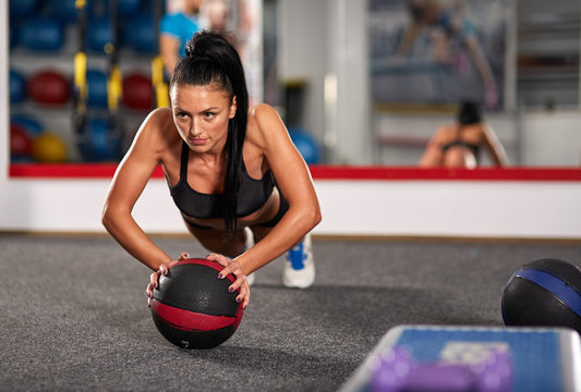 Young Woman With Medicine Ball