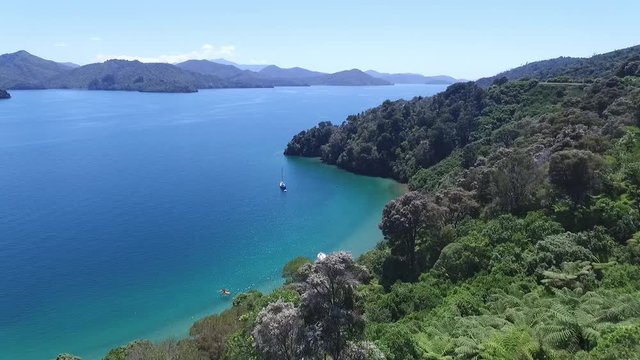 Aerial Drone moving slowly forwards over beautiful Marlborough sounds Nature Landscape in New Zealand with water lake sunny theater 4k