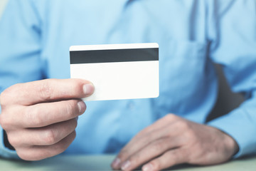 Man showing credit card.