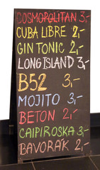 billboard of the pub menu with lots of drinks and the price