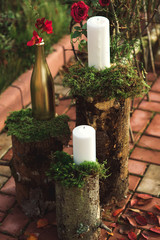 Rustic arrangement of candles in garden