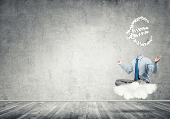 Headless meditating businessman
