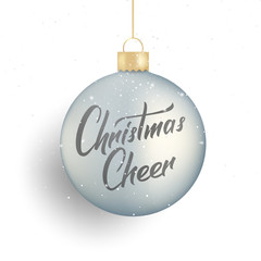 Christmas. Winter seasonal script lettering Christmas Cheer and realistic Christmas ball and snow.