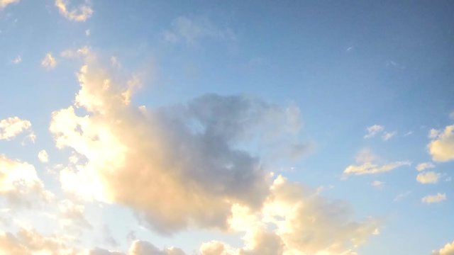 many floating sunset clouds in the sky timelapse