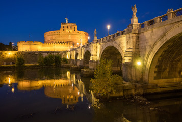 Fototapeta na wymiar Rome (Italy) - The Tiber river and the monumental Lungotevere. Here in particular the Castel Sant'Angelo monument