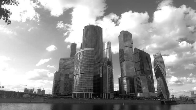 skyscrapers on the river bank in summer black and white timelapse