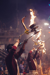 VARANASI, INDIA- 23 JANUARY 2017 : A Hindu priest performs the Ganga Aarti ritual in Varanasi