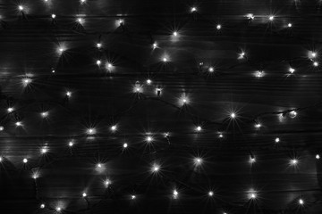 Christmas lights black and white effect background.