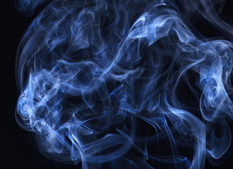 Blue smoke on black background.