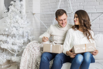 Happy couple. Christmas interior.