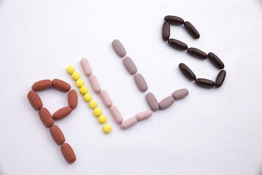 Conceptual Hand writing text caption inspiration Medical care Health concept written with pills drugs capsule word PILLS season On white isolated background with copy space