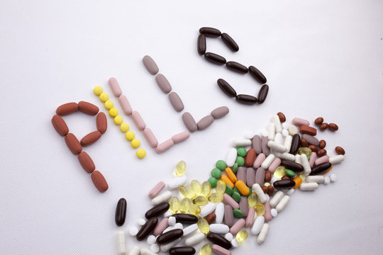 Conceptual Hand writing text caption inspiration Medical care Health concept written with pills drugs capsule word PILLS season On white isolated background with copy space