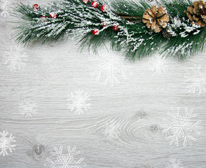 Christmas and New Year's composition. The pine cones, spruce branches on a wooden white background