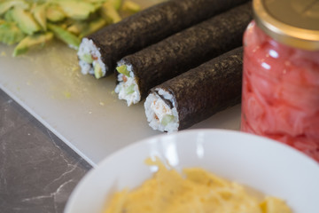 Fresh Homemade Sushi Roll with salmon, rice and nori. closeup