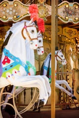 Side view of carousel horses